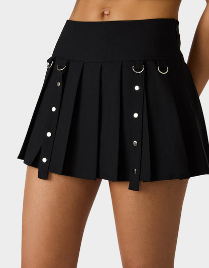 REBEL RIVET PLEATED SKIRT BLACK - APPAREL - Betsey Johnson